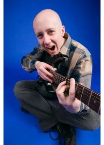 The musician smiles